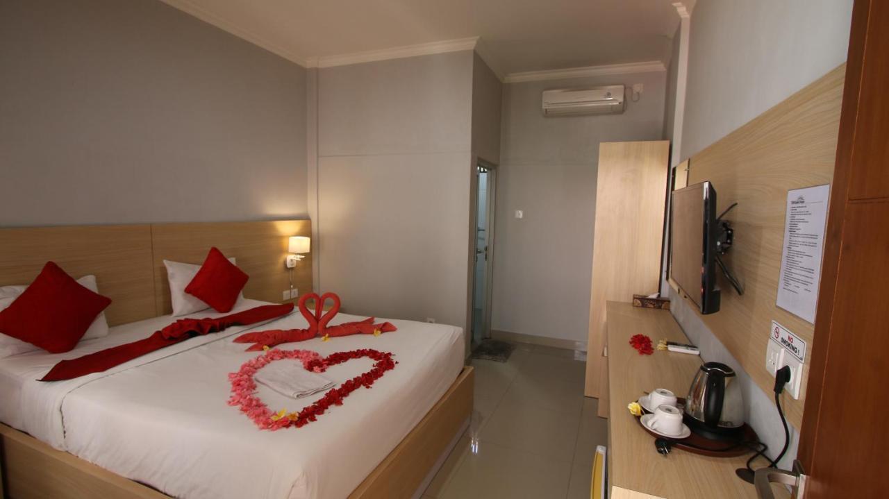 Tom Guest House Легиан Экстерьер фото